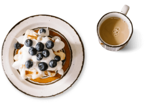 About Us bg image cake and coffee 300x211.png